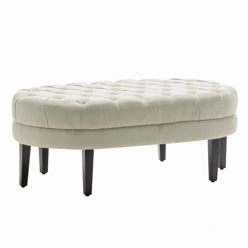 Pouf de cocktail ovale en tissu Itan de Porthos Home avec pieds en bois d'hévéa