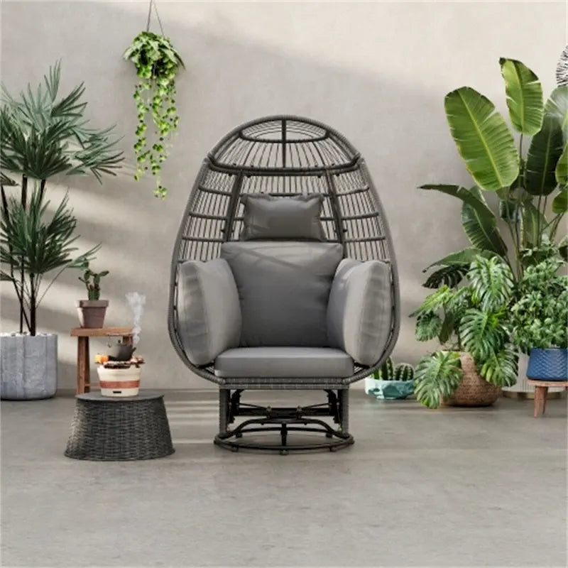 Fauteuil pivotant de jardin en rotin en forme d'œuf avec coussins et fonction à bascule