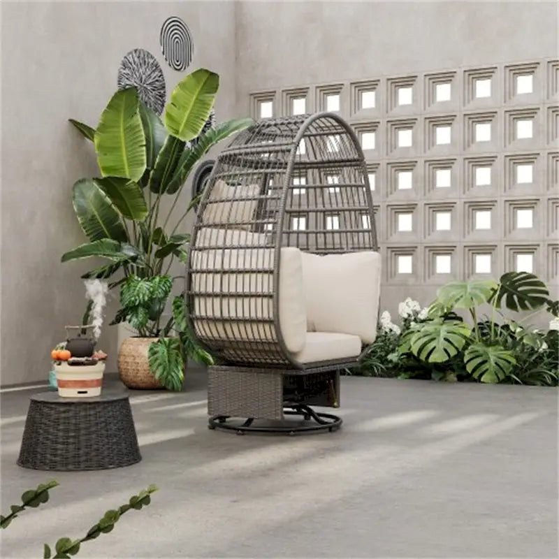 Fauteuil pivotant de jardin en rotin en forme d'œuf avec coussins et fonction à bascule